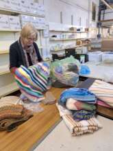 Volunteers are sorting items for the container