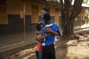 Children hugging themselves