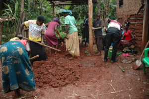 Women pulling  forces together to prepare soil