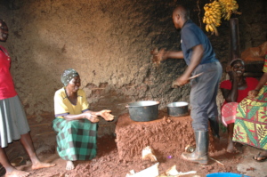 Women learning how to make cookstove on day two