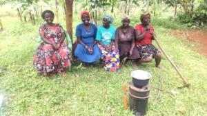 Women cooking using  improved stove