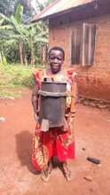 Rosemary with her clean cooking gasifier cookstove
