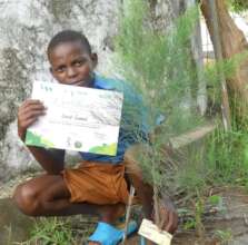 Student Holding his Conservation Certificate