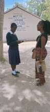 Ark Staff with a student during bursary payment