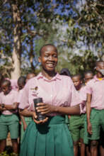 ASSETS student planting trees in her school
