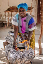 ASSETS parent using her self-made fireless cooker