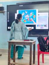 A Teacher learning to use the Smart Board