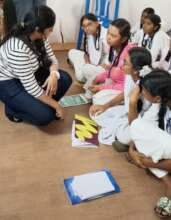 Volunteers teaching students