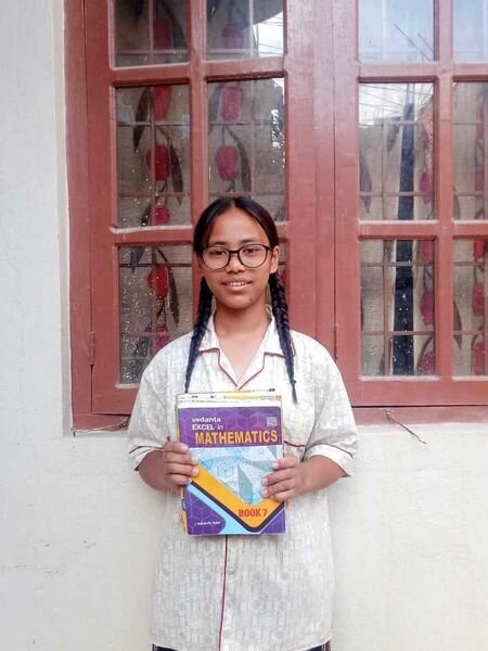 Pratikshya class-7 is happy with her study.