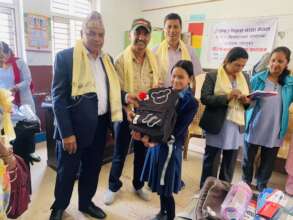 Children receiving educational materials