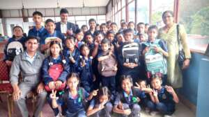 Students happily displaying their stationary sets
