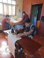 Youth in sewing/machine repair class