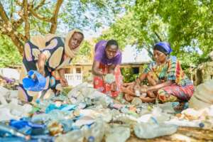 Mama Karangas sorting beach waste