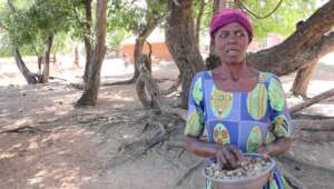 Euphemia with a calabash of peanuts