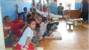 A clown entertains children at New Life Center