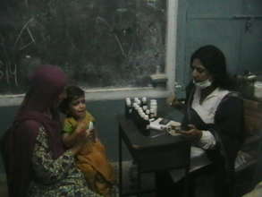 Lady doctor examines a patient in Balochistan