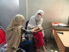 A mother in Swat receives medical attention