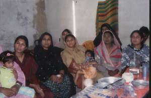 women in community meeting.