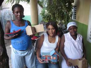Members of the Microenterprise Project and houses!