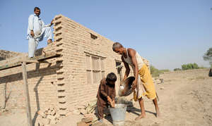 Arsalan,10 helped his farther building their house