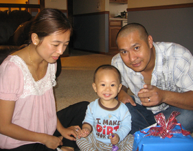 Lum and Min with their son, Bless