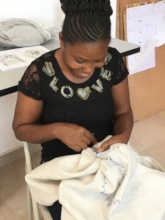 Clarisse Embroidering Haiti Projects' Laundry Bag