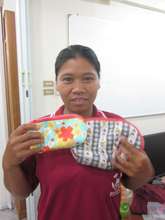 Aea shows her first fabric bag.