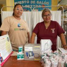 Nurse Luisa receives the donations from EcoSwell