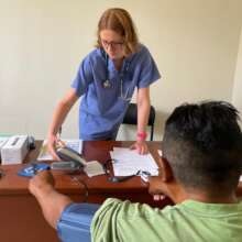 Med elective Izzie taking care of local patient