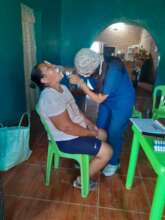 Claudia performing an oral examination