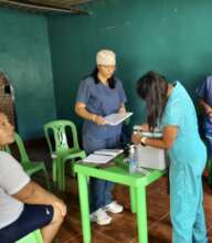 Staff organizing vaccines and medications