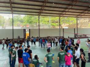 Scholarship students and volunteers in a workshop