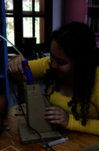 STEM participant building a robotics prototype
