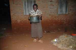 Farmer carrying harvested wax with honey
