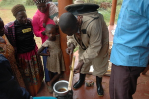 Demonstrating how to "bait" the beehive with wax