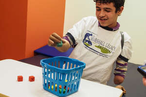 Mohammad in the US, learning to use his new limbs