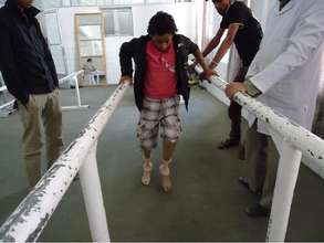 Young survivor learns to walk on new legs