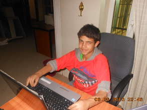 Young survivor uses prosthetic arms/hands to type