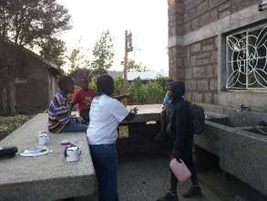 Sharing gifts from a sponsor with brothers