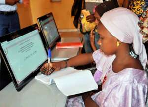 Hawa gets to learn how to use the tablet