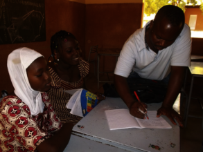 Tutor helping students with French homework