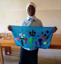 Aminatou with her embroidery
