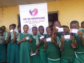 Students proudly display FAC booklet