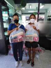 Women picking up food donations from our Center