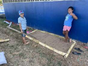 Kids in Nuario working on their school orchard