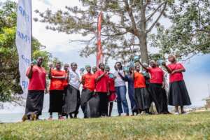 Girls pose with their menstrual hygiene products