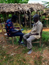 Researcher from UNIBU interviewing a farmer