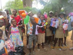 Kids In Rimbi Village Receiving School Supplies