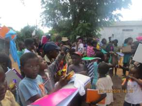 Kids In Rimbi Village Receiving School Supplies
