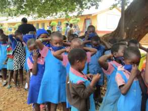 Distributing Masks To Rimbi Primary School
